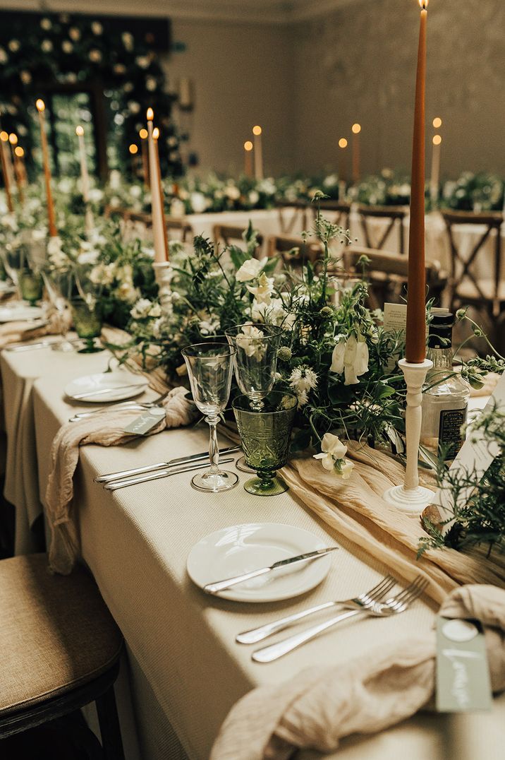 Traditional wedding with natural tablescape - foliage table runners and taper candles 