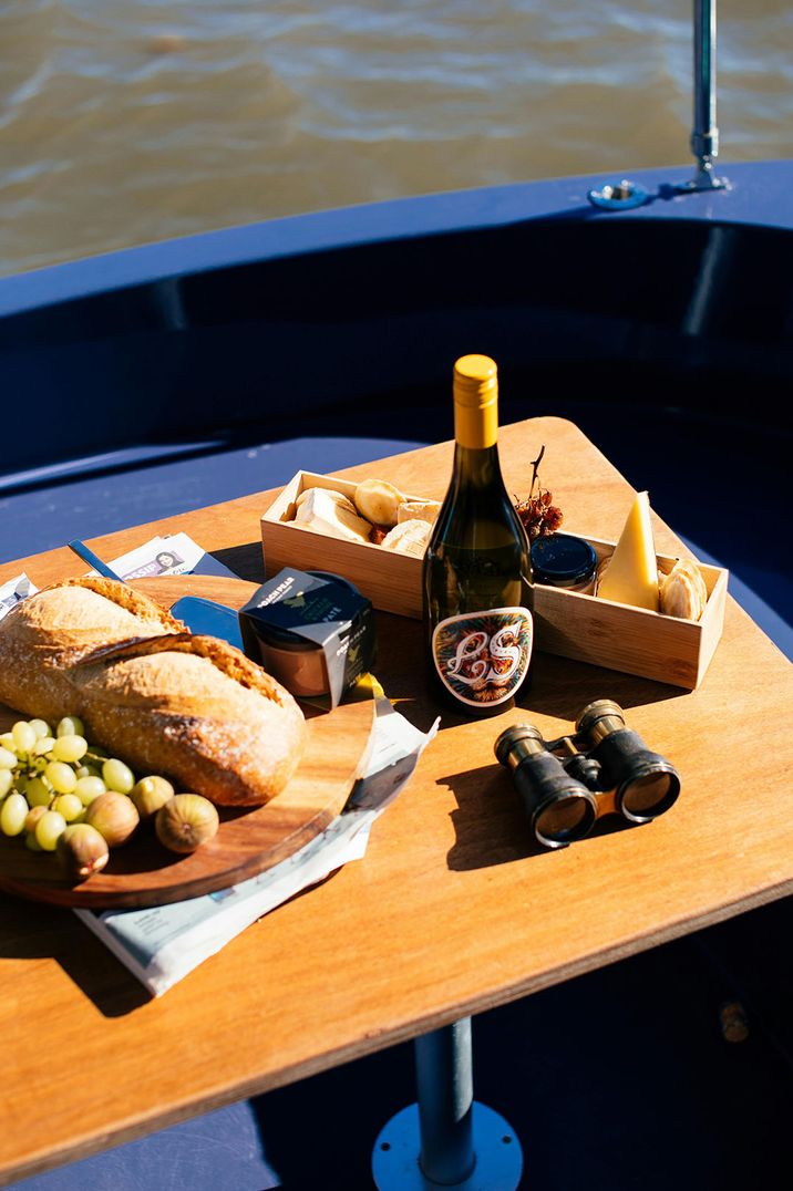 Stock image of charcuterie board, prosecco and snacks on a boat