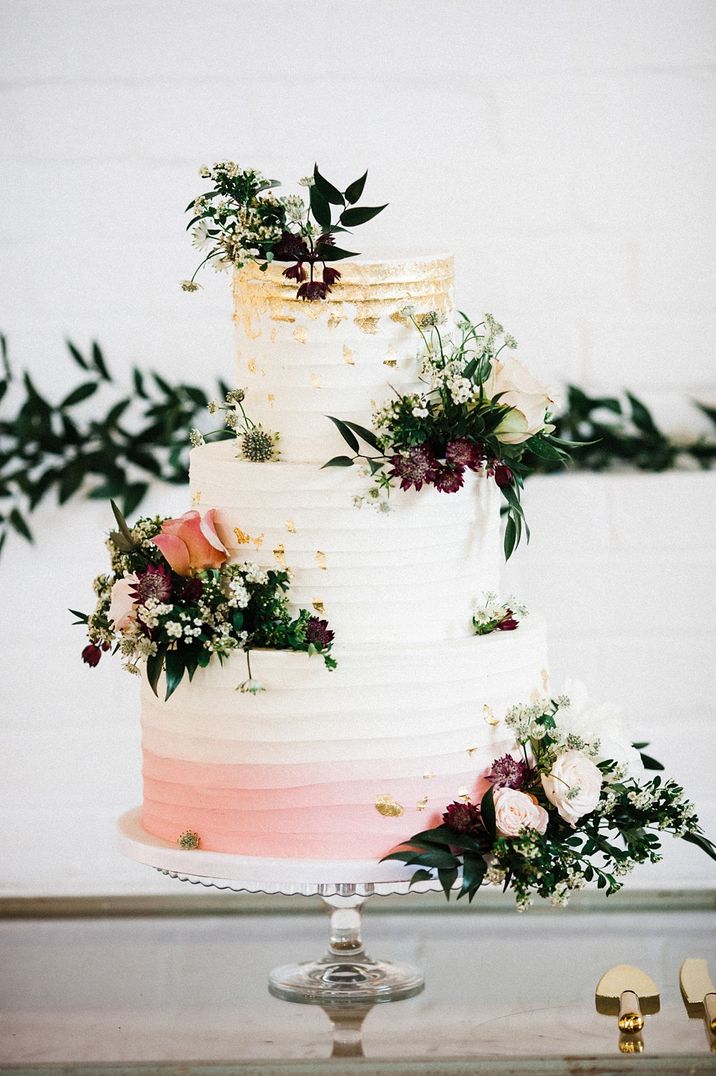 Ombre buttercream wedding cake with gold lead decoration