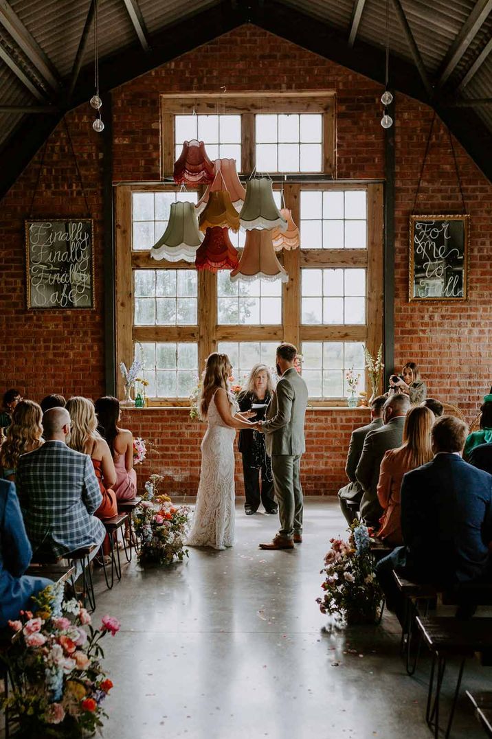 Bride and groom at the alter of The Giraffe Shed - one of the most Instagrammable wedding venues