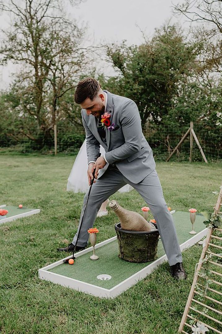 Stag playing crazy outdoor golf 