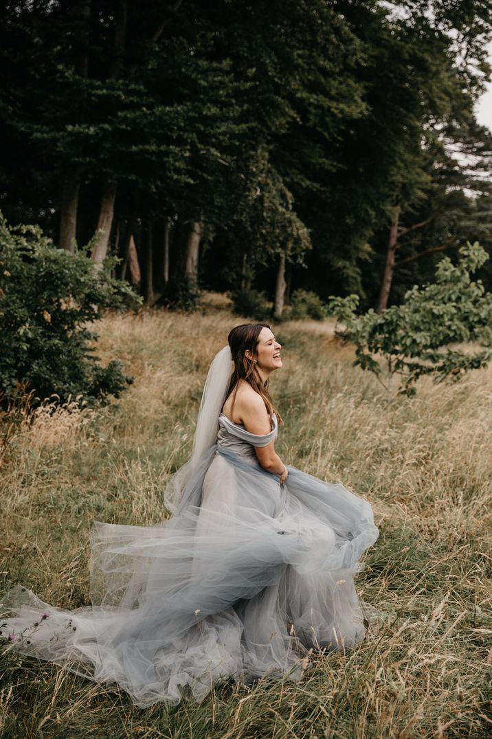 Blue, grey tulle ballgown princess wedding dress with off shoulder detail by Rivkah Photography