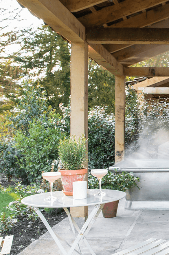 Image of steaming bath spa on a terrace with table and chairs at Middleton Lodge Estate