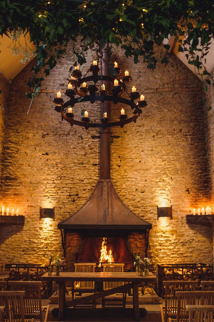 Stone Barn wedding venue with cosy warm lighting and candles for winter weddings 