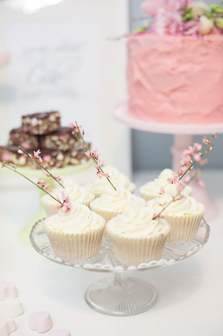 Image of white cupcakes for weddings with delicate decoration by Julia & You Photography