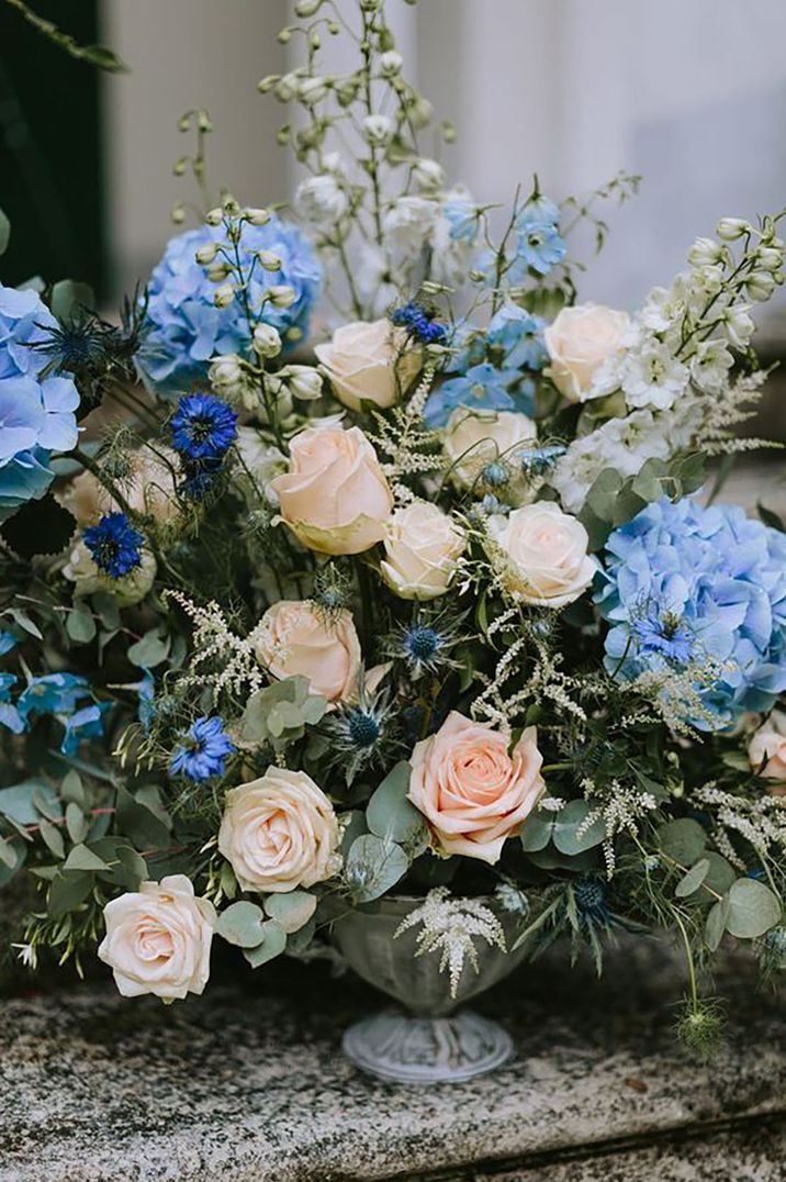 Blue wedding flowers with soft peach and creams accents by Thomas Steibl Photography 