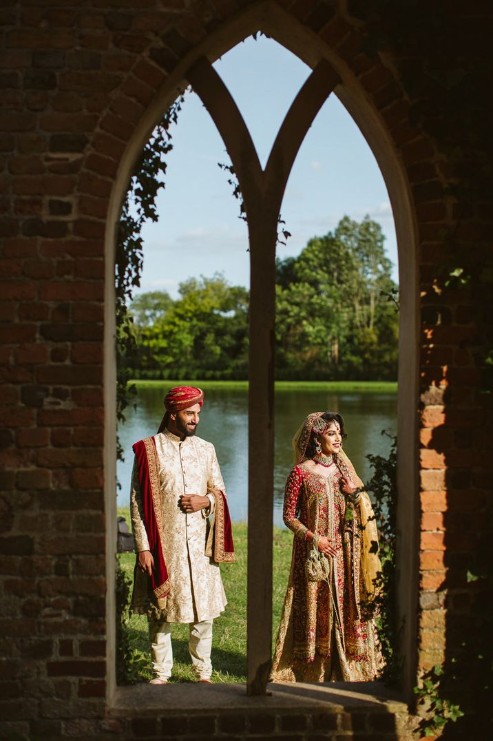 Muslim wedding with the bride and groom walking around the park in Surrey 