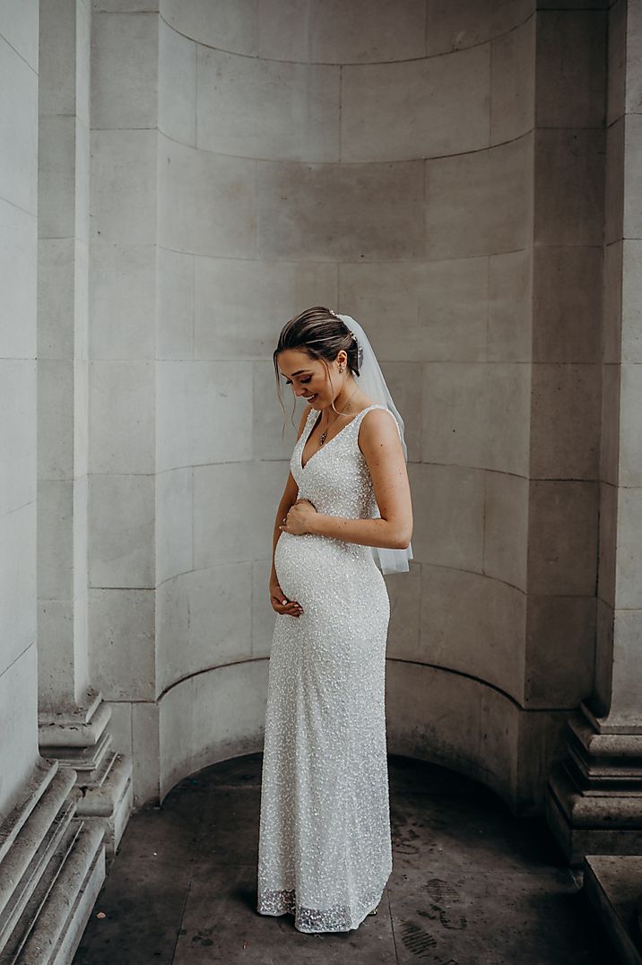 Beautiful pregnant bride in a sparkly maternity wedding dress 