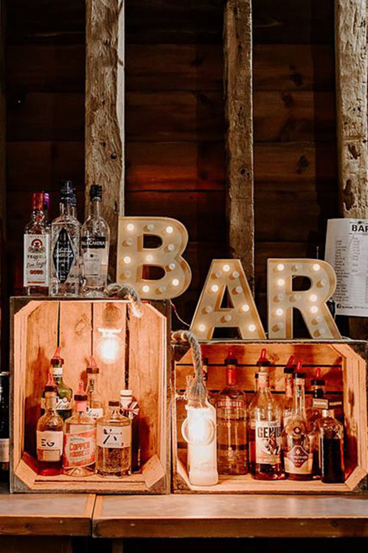 Rustic wedding bar design ideas with letter lights signage with wooden crates 