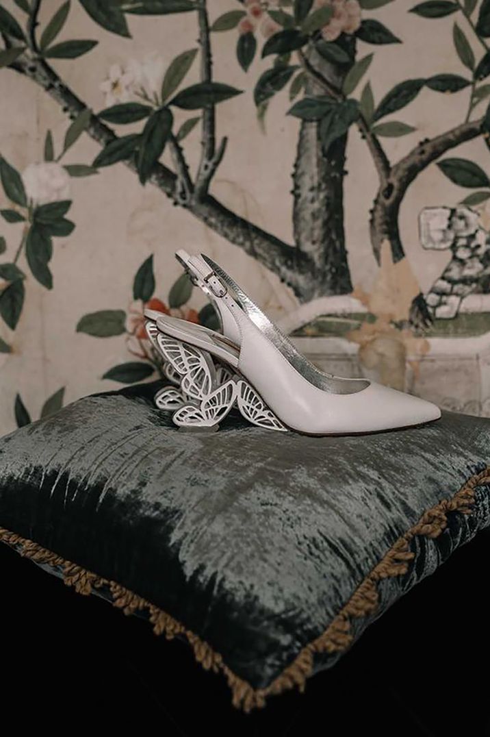 White wedding shoes with butterfly heel by Divine Day Photography 