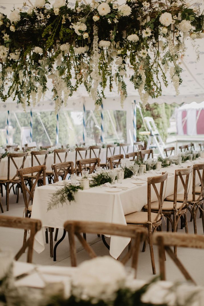 All white wedding decor for the marquee wedding reception with white flower installation for 60k wedding 