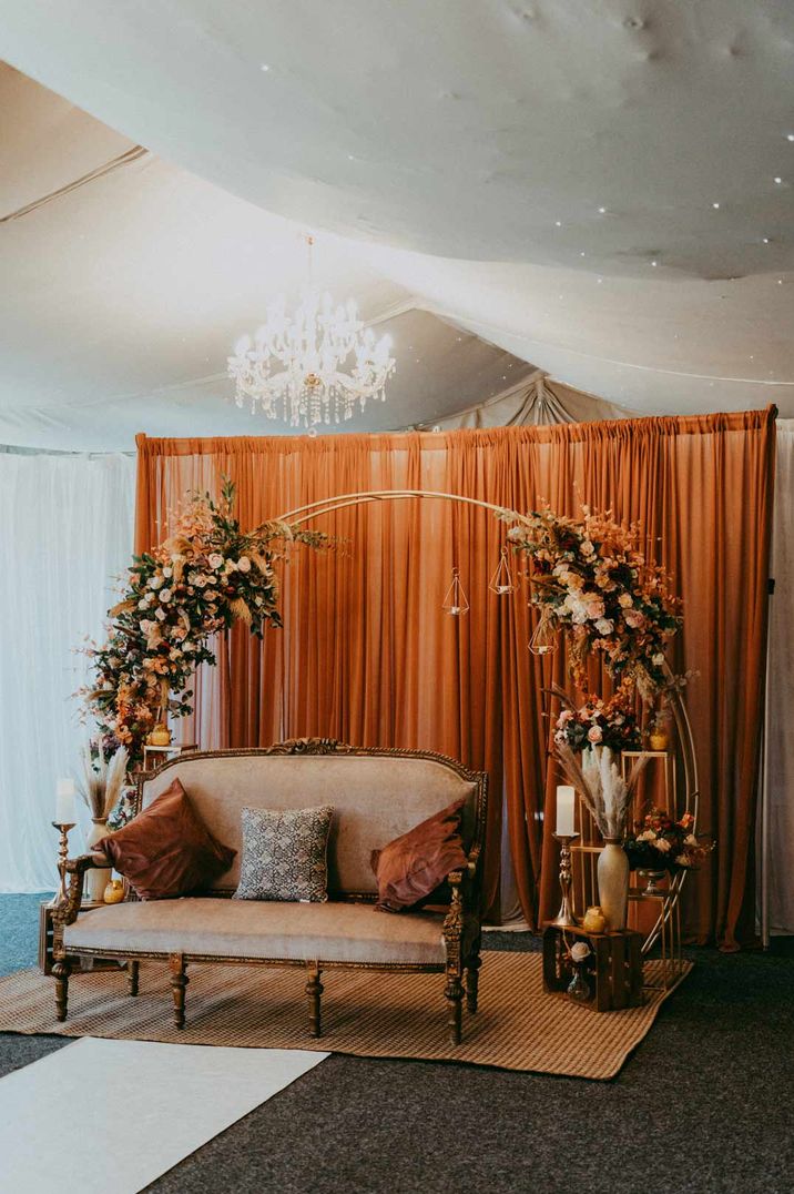 Wedding decor and hire - wedding floral arch with sofa and pampas grass wedding decorations 