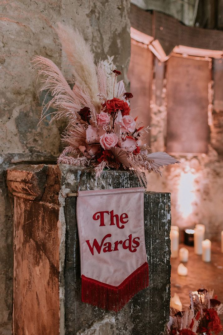 Valentine's wedding theme with pink and red colour palette showcasing their customised wedding banner sign 