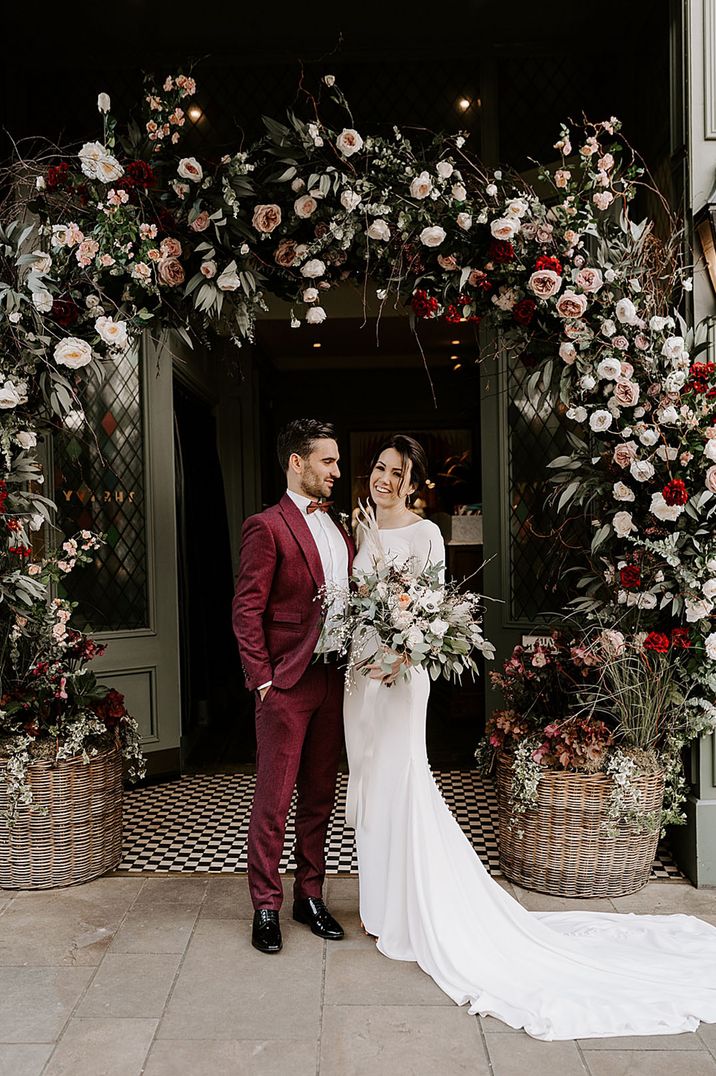 Registry office wedding with stunning wedding flower arch arrangement 