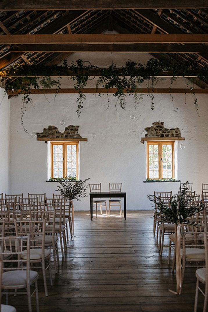 Indoor wedding ceremony space at Cornwall wedding venue with rustic decor 