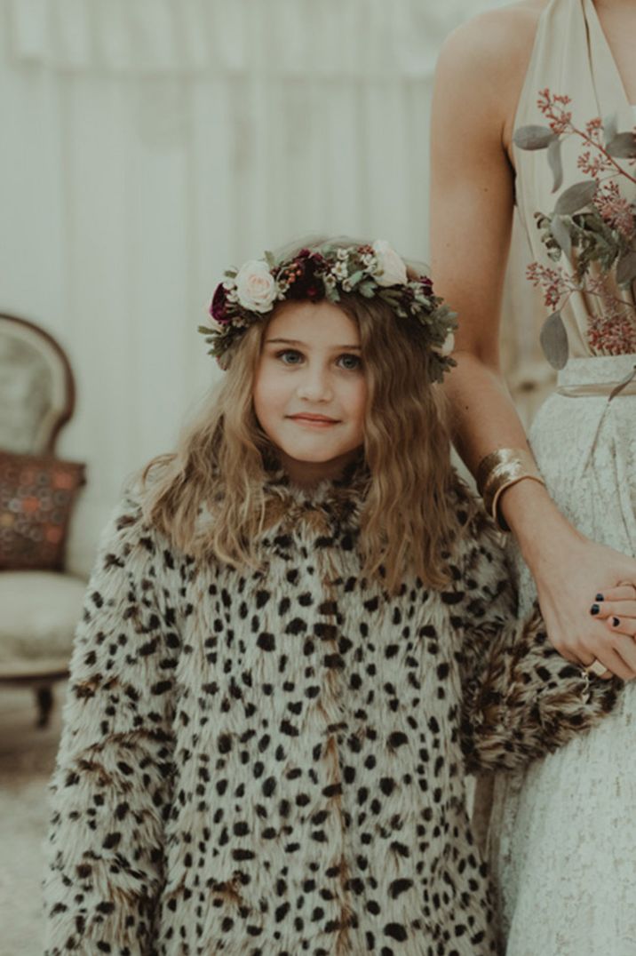 Flower girl in big flower crown and fluffy Dalmatian pattern cover up 