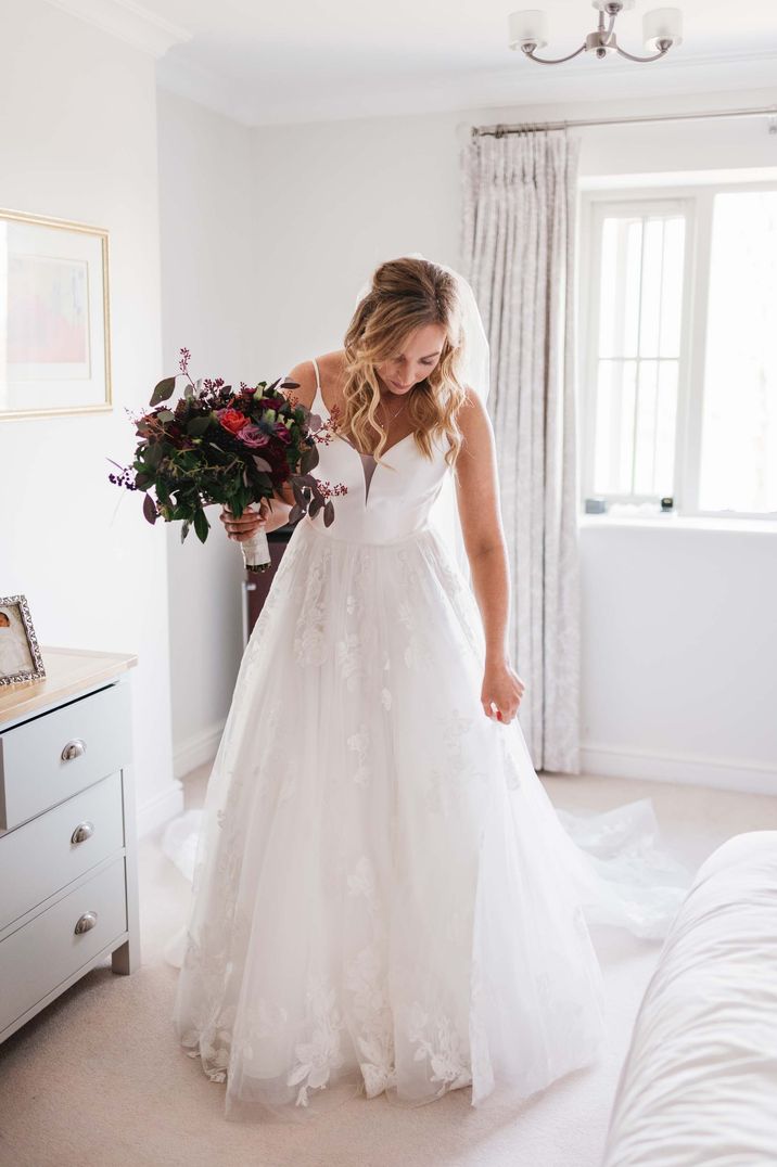 Bride in a layered princess wedding dress