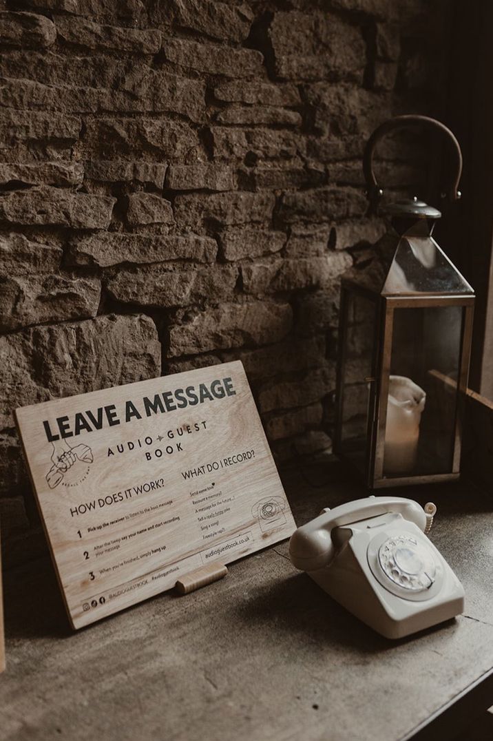 wooden sign and white retro telephone interactive audio guest book