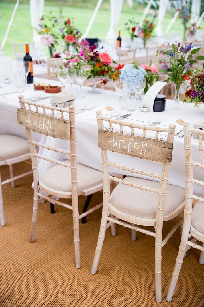 Bride and groom wedding banner signs to reserve the seats for the happy couple 