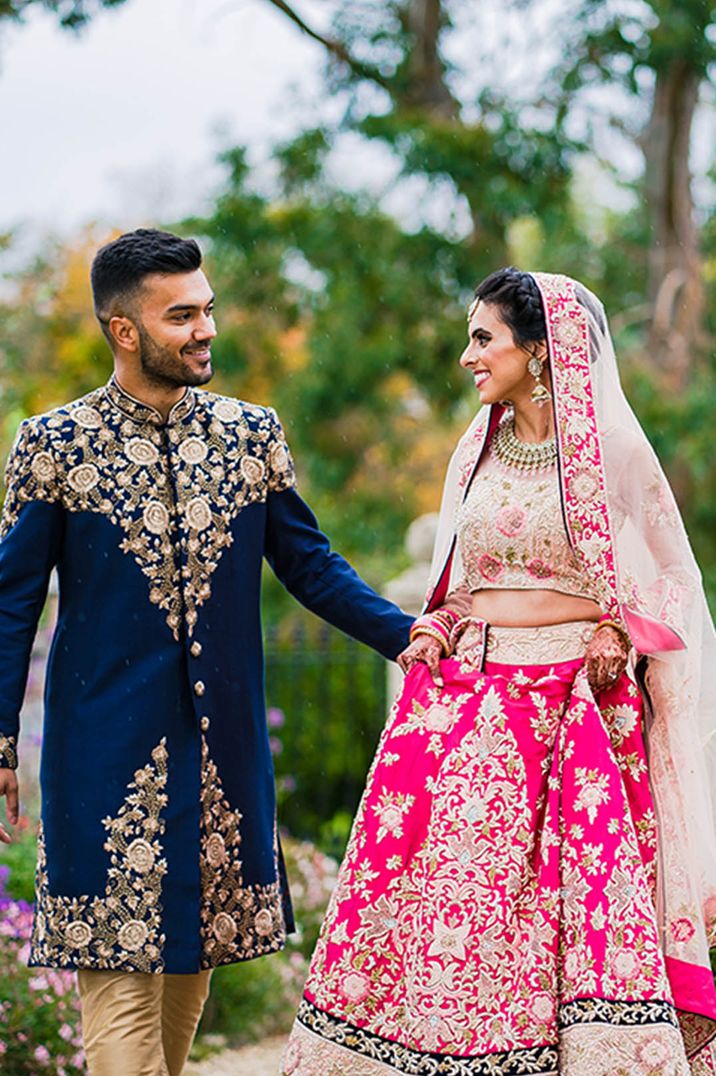 Navy and gold and pink and gold groom and bridal outfits for the Hindu fusion wedding 