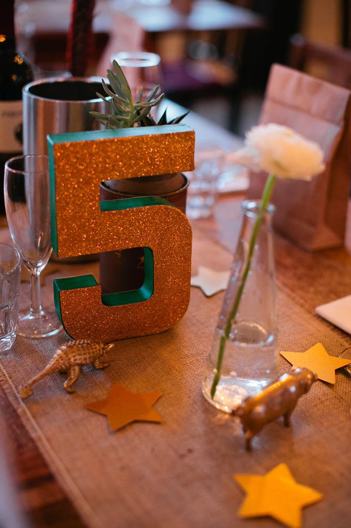 Large 3D table number covered in gold glitter for vintage style wedding 