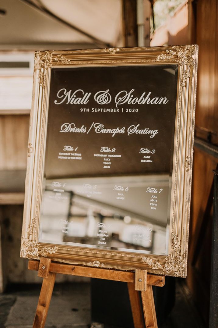 Gold mirror with white font table plan 