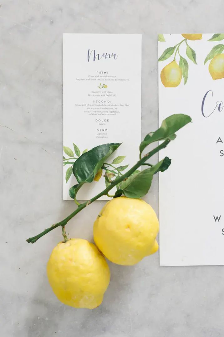 Lemon-themed wedding decor featuring wedding menu and citrus table decor by Irene Fucci photography