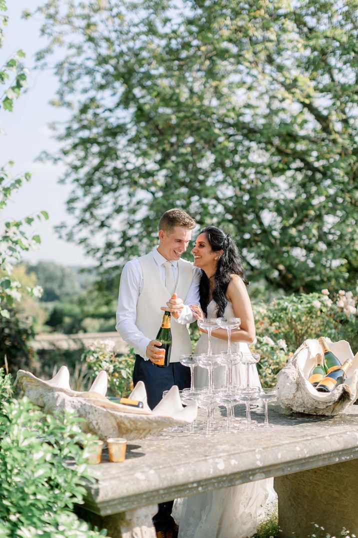 Bride and groom pouring the champagne tour 