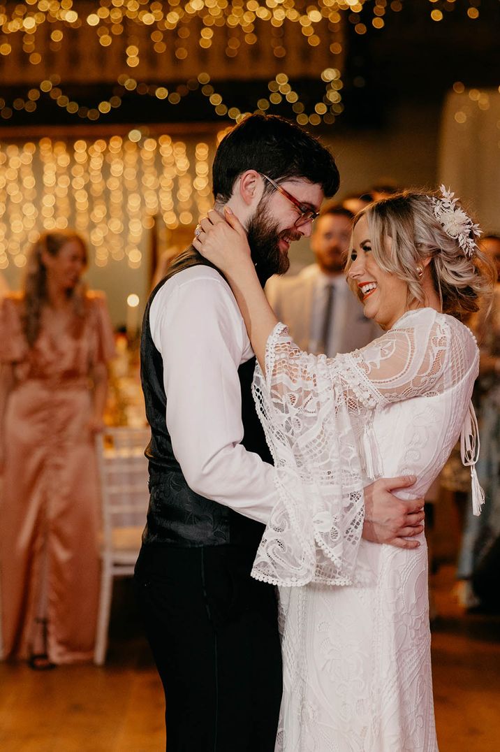 The bride and groom share their first dance together as a married couple 