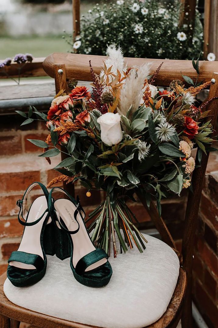 Glasshouse wedding with autumnal bouquet and green velvet wedding shoes with platform 