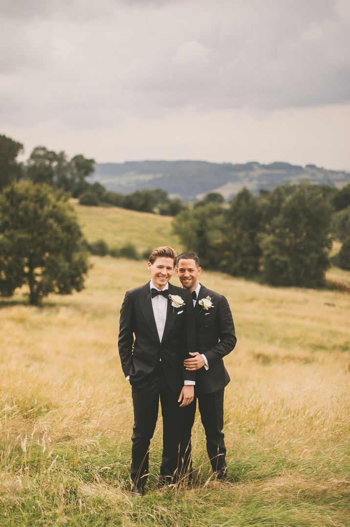 Two grooms in tuxedos at classic wedding in Worcestershire 