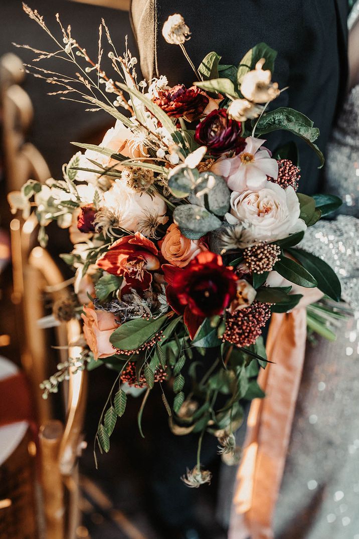 Red and pink wedding flower bouquet made by Moody Blooms 