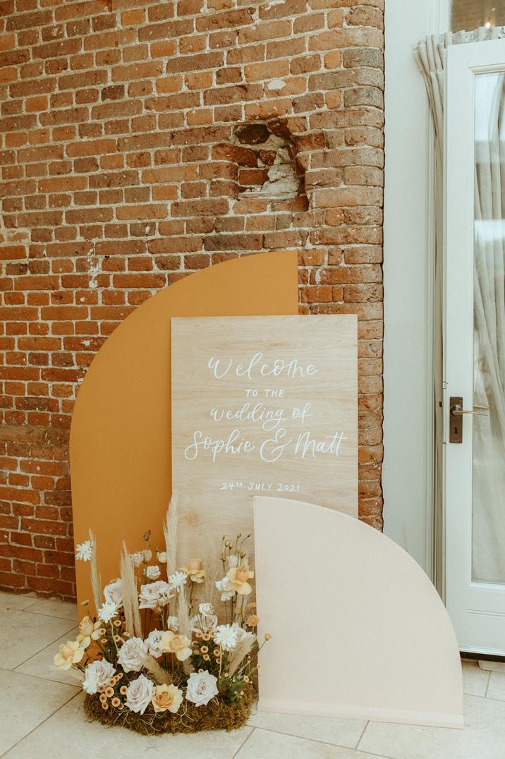 Orange and ivory welcome wedding sign with dried flower decoration 