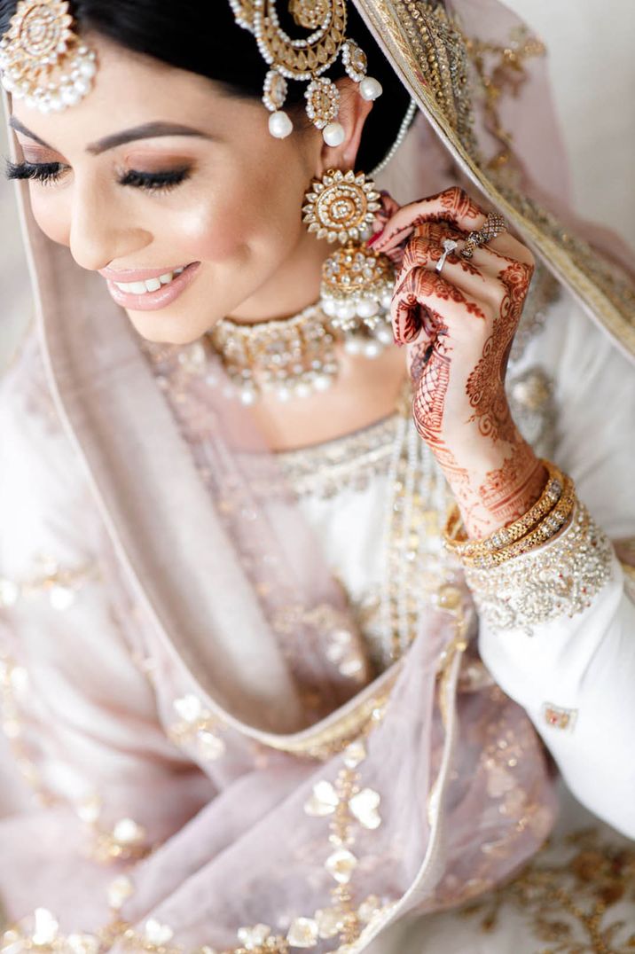 Gold and pearl wedding jewellery worn by the bride for traditional Pakistani wedding 