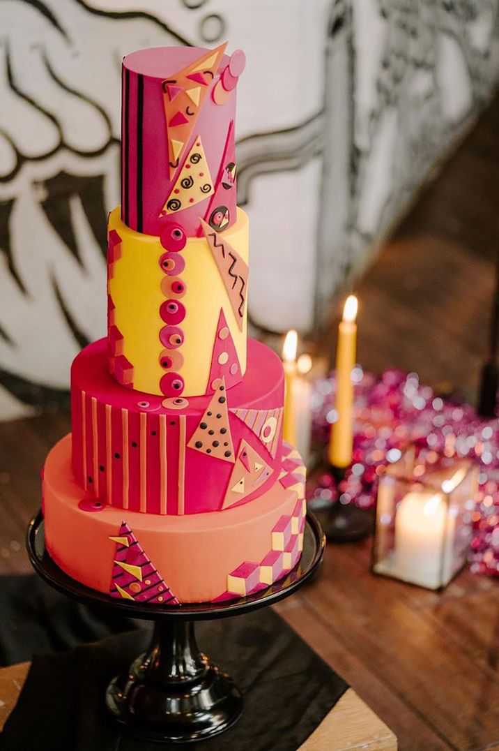 Pink and yellow abstract iced design on wedding cake for summer wedding 