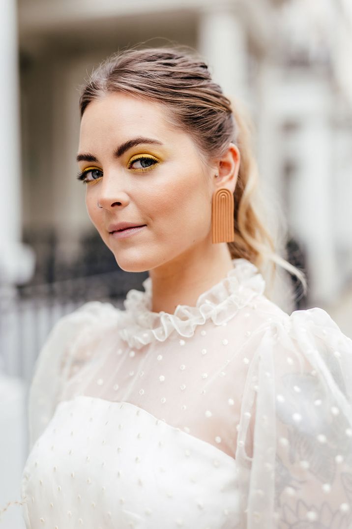 Bride with yellow bright makeup and eyeshadow for wedding 