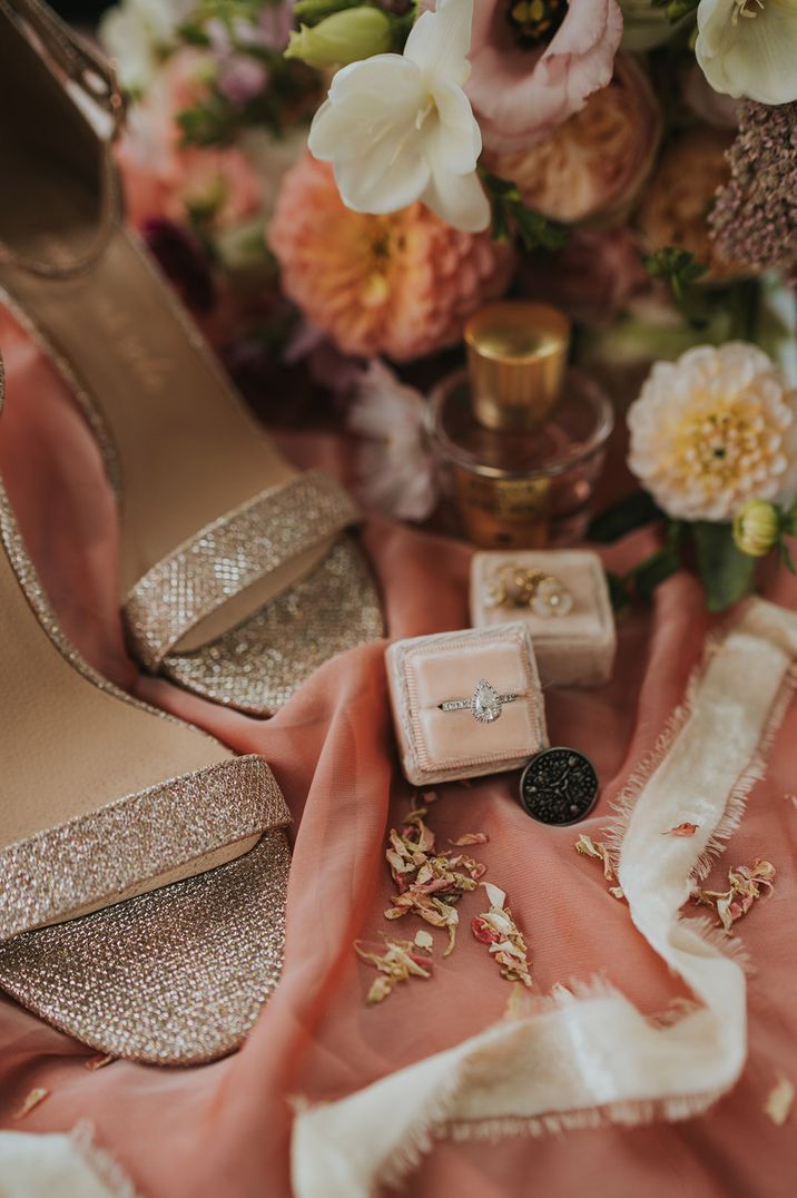 Sparkly gold wedding shoes with pink velvet ring box with diamond engagement ring 