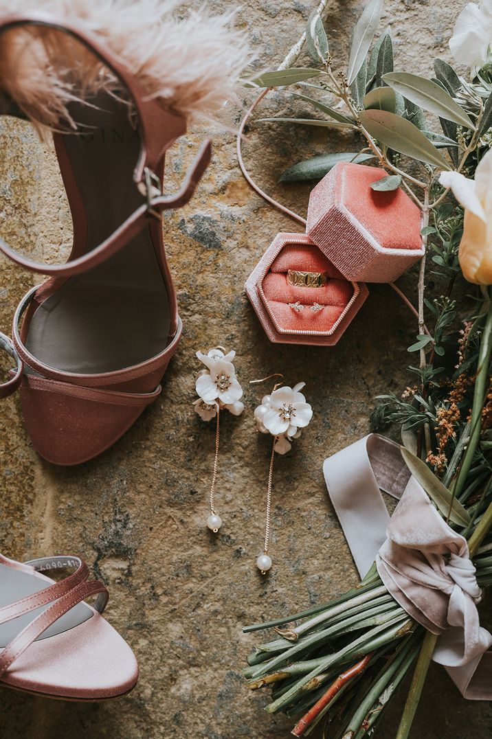 Pink suede wedding shoes, white ceramic flower earrings and gold rings in pink box 