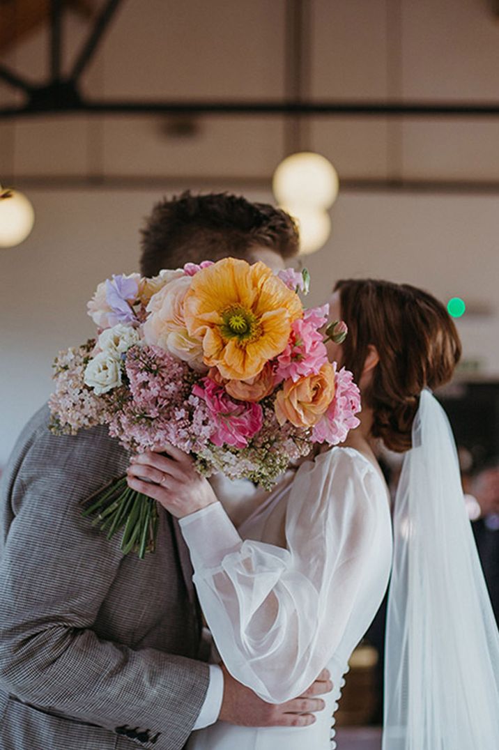 Birth flowers by month with poppies for August used in colourful wedding bouquet 