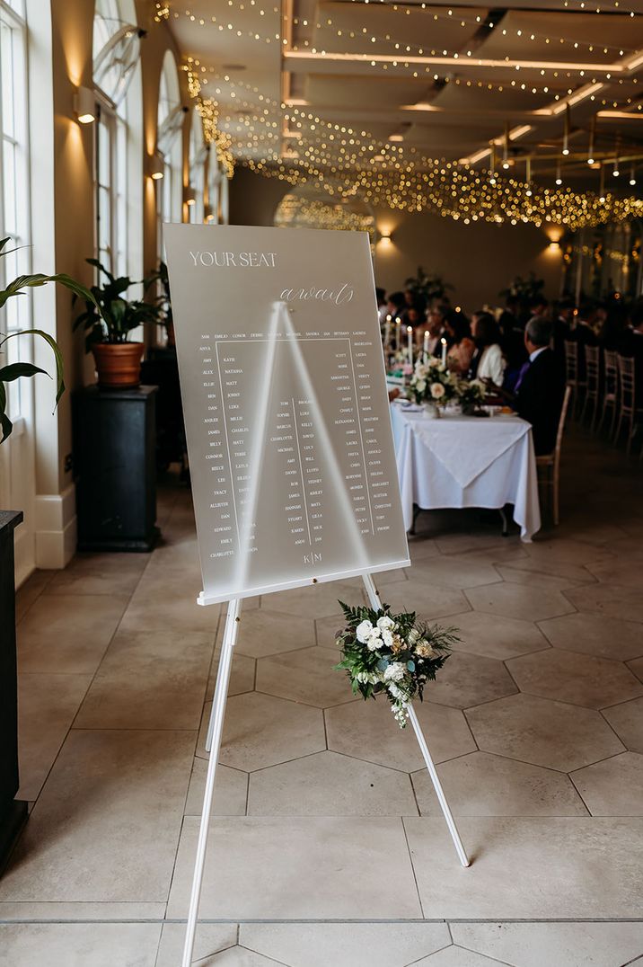 Frosted perspex wedding seating chart signage for classic black tie LGBTQIA+ wedding 