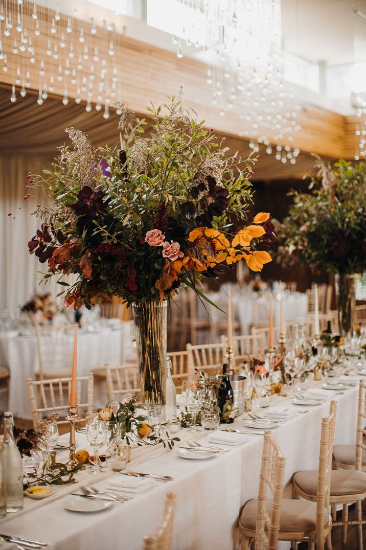 Elmore Court wedding with large green and orange centrepieces for classic tablescape 