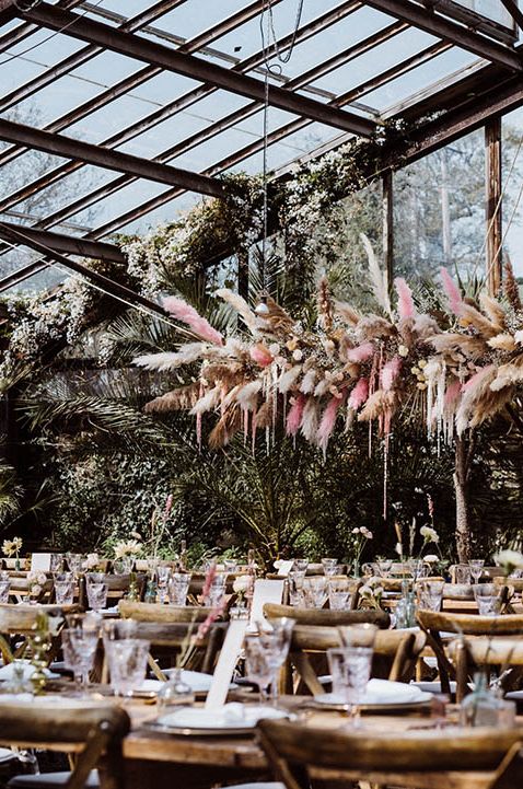 Large flower installation with pastel coloured pink pampas grass 