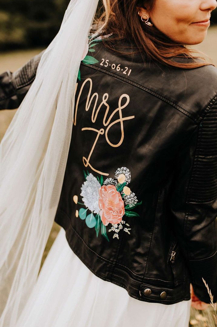 DIY bespoke leather jacket with painted on roses and lettering