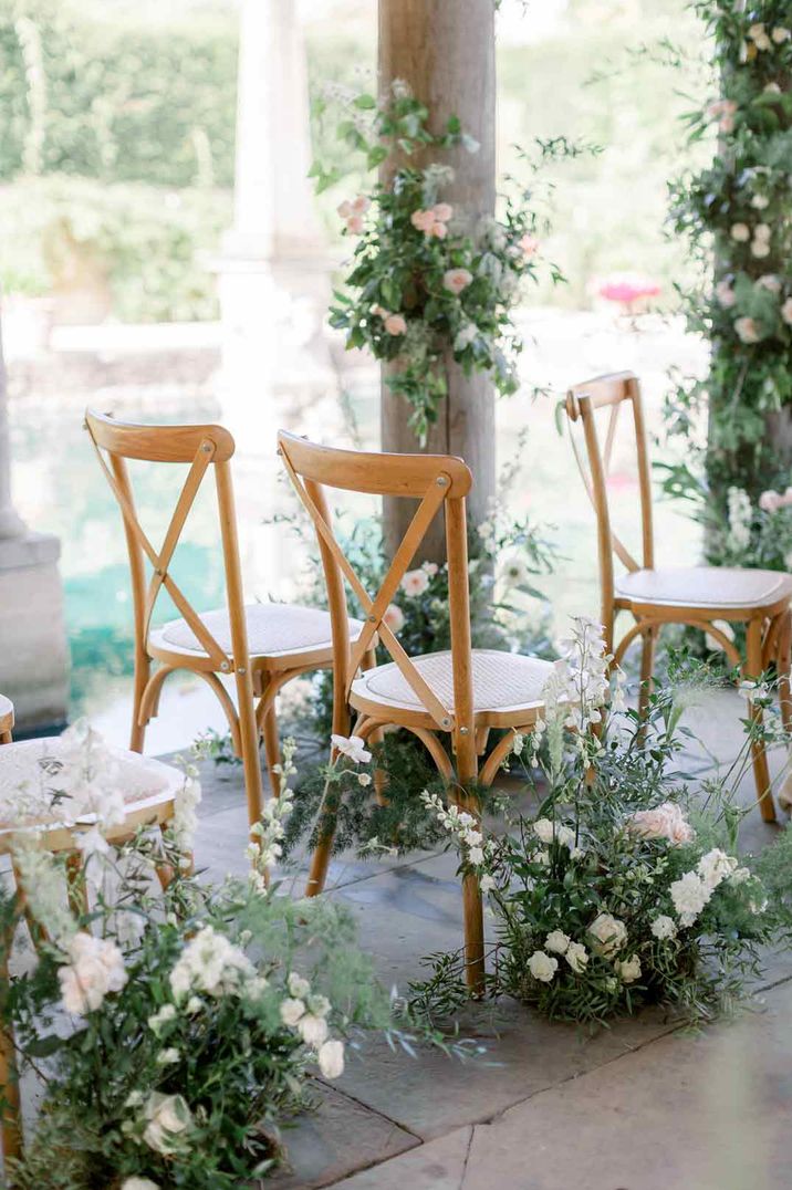 White rose, baby's-breath, eucalyptus and dried flower aisle flower arrangements 