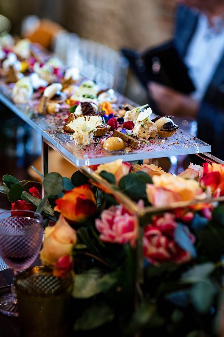 Colourful wedding dessert table for casual wedding breakfast 