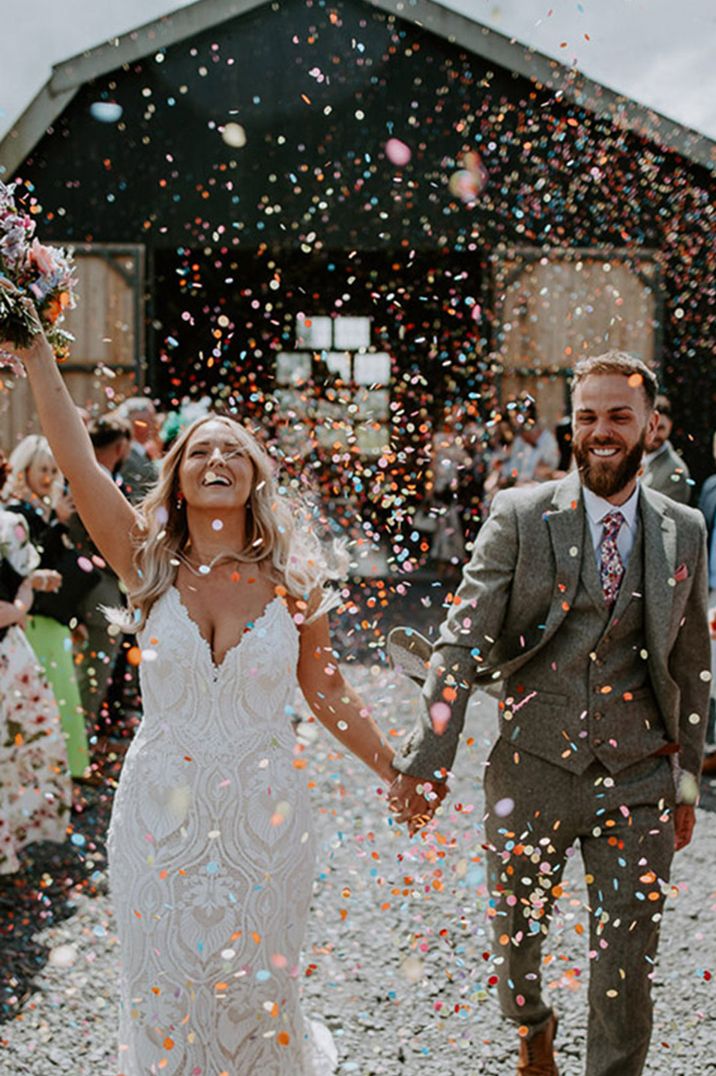 Colourful confetti exit at The Giraffe Shed wedding venue 