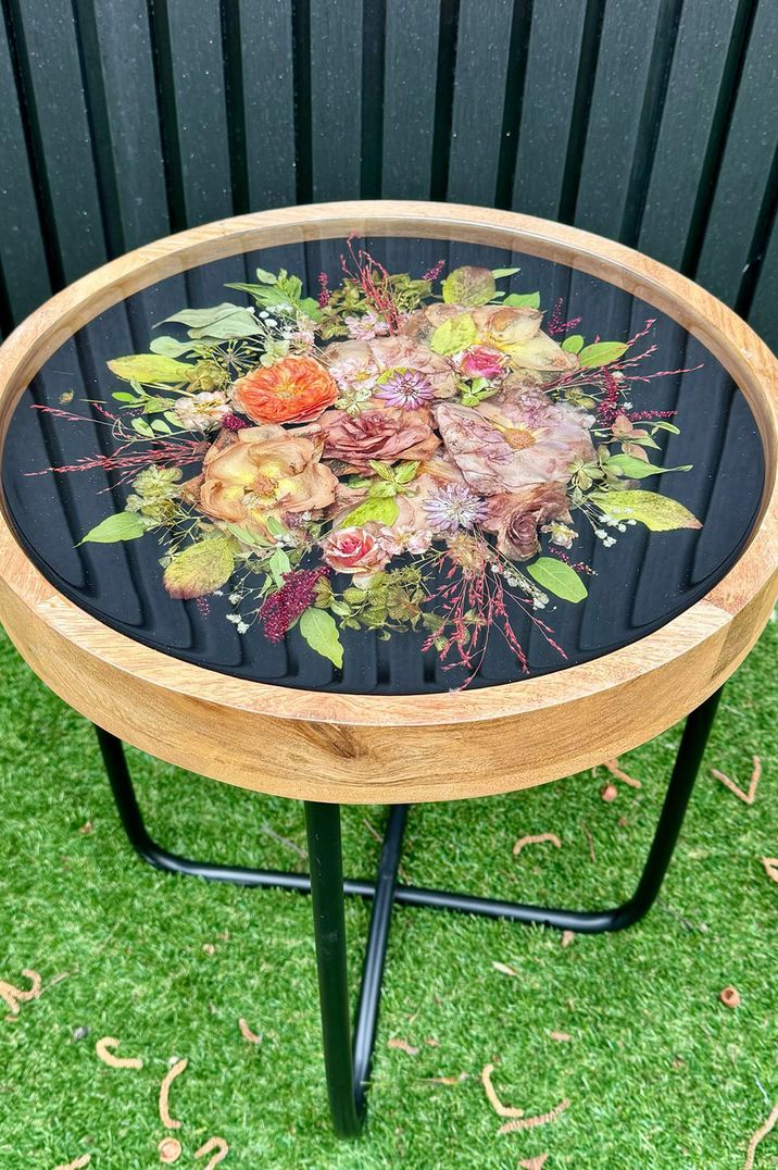 Wedding bouquet preserved in small accent table 