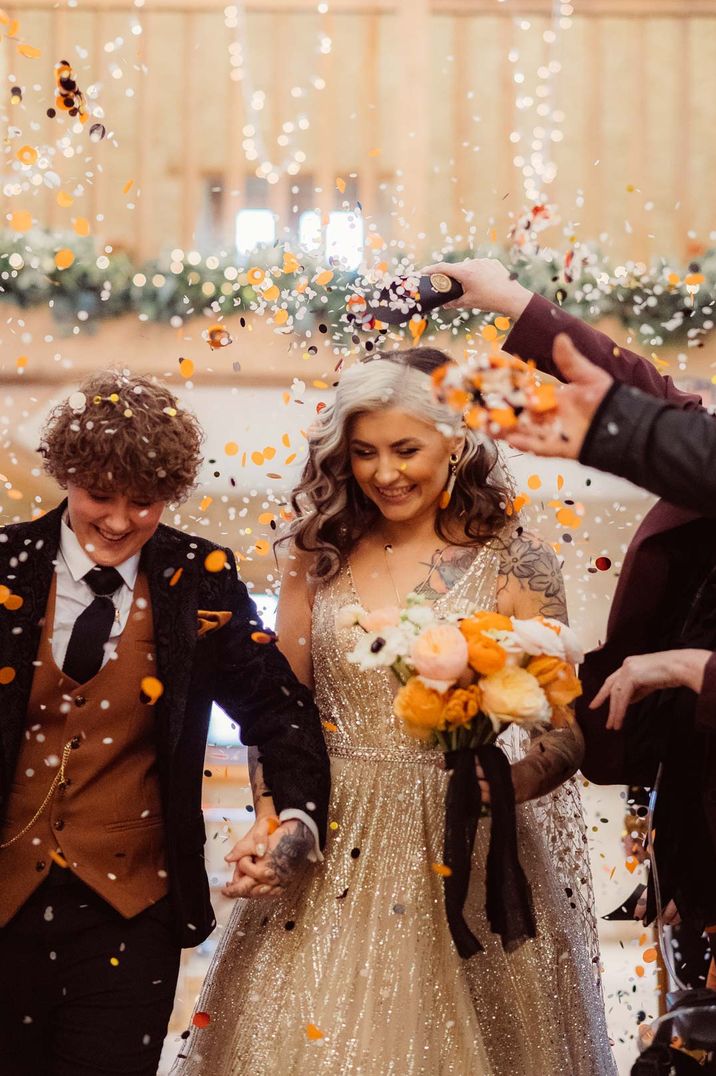 Wedding confetti exit for two brides at their wedding ceremony for LGBQTIA+ wedding 