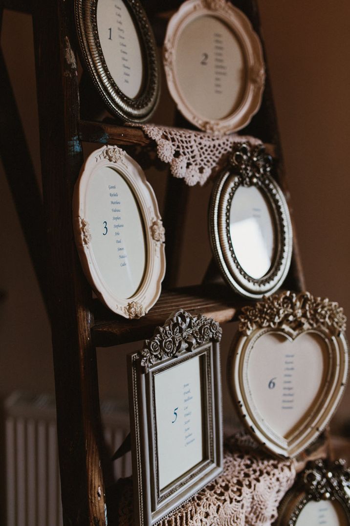 Mismatched photo frame table plan with different colour and shape photo frames 