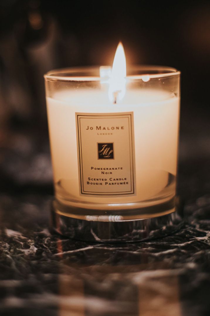 Jo Malone London candle lit to scent the wedding in classic pomegranate noir fragrance 